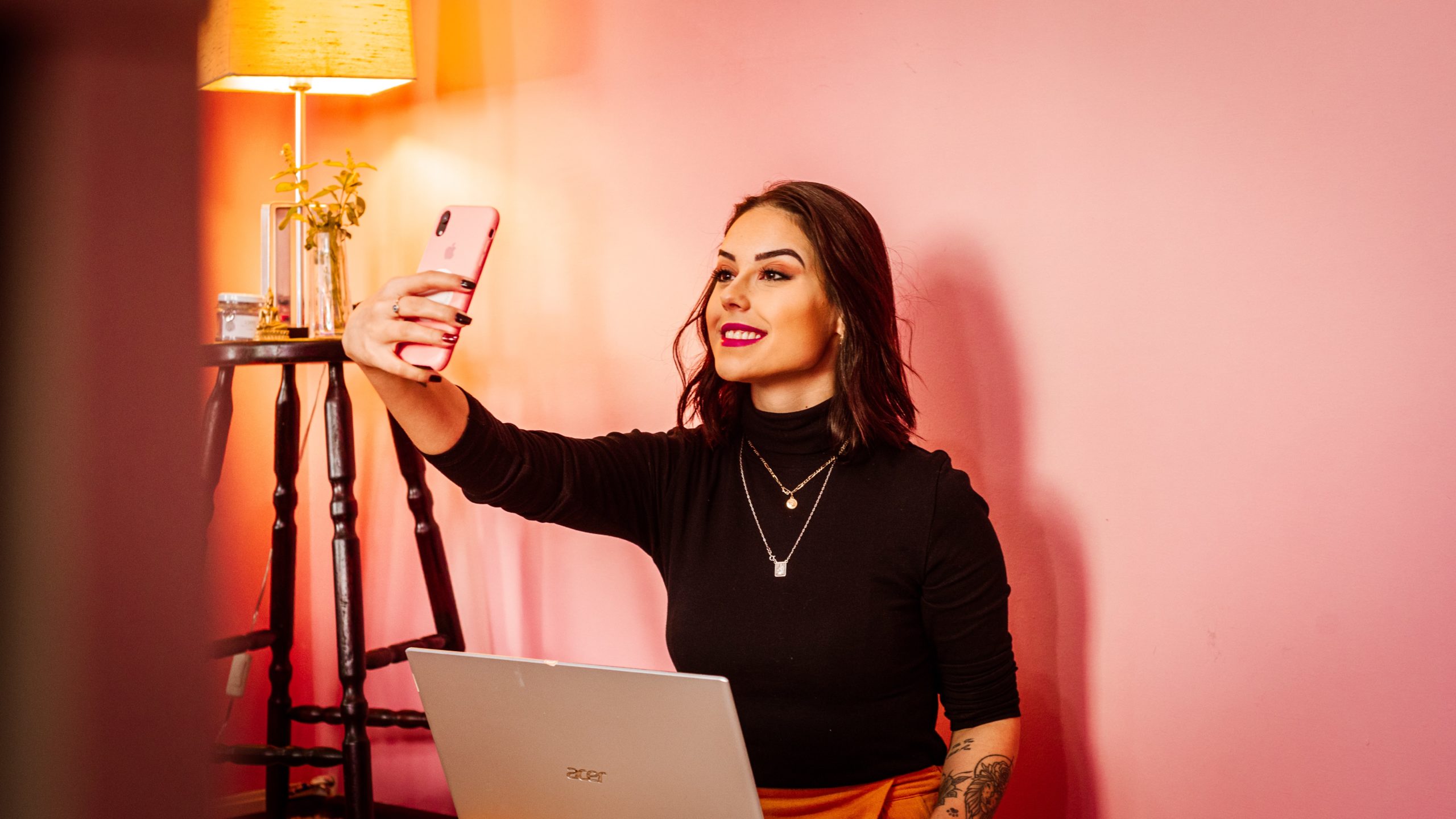 A women influencer taking selfie in a mobile